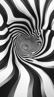 Swirling black and white patterns form a mesmerizing tunnel illusion in an abstract art piece photo