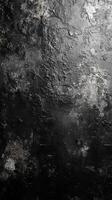 Textured dark surface resembles rough stone, creating an abstract backdrop for artistic purposes and design elements photo