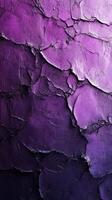 Textured wall featuring intricate cracked patterns in shades of purple during daytime light photo