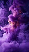 Swirls of purple and orange smoke create an abstract pattern in a dark environment photo