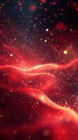 Abstract red and gold particles shimmering in the dark with flowing wave patterns during a creative design session photo