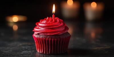 Delightful red velvet cupcake with candle glowing in warm light setting perfect for special celebrations photo