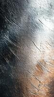 Abstract texture showing intricate patterns of light and shadow on a metallic surface photo