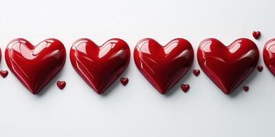 Red hearts arranged in a row on a white background creating a romantic and playful atmosphere photo