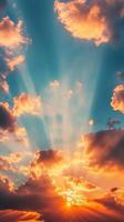 Dramatic sunset with vibrant clouds and rays of light shining through in a clear sky at dusk photo