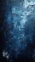Textured dark blue wall with dramatic lighting showcasing abstract patterns and shades at an indoor location photo