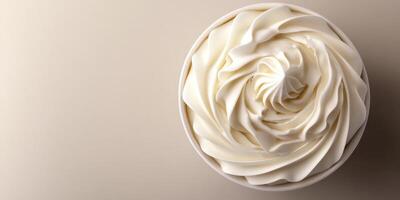Beautifully swirled whipped cream in a bowl showcasing intricate patterns and smooth textures photo