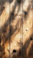 Natural wooden texture with shadows creating a play of light in a rustic setting photo