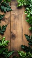Fresh green leaves arranged beautifully on a rustic wooden surface creating a natural frame for decoration photo