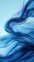 Swirling shades of blue create an ethereal atmosphere with delicate fabric movements in soft light photo