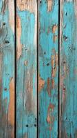 Weathered wooden boards with vibrant turquoise paint in distressed condition showcasing textures and colors of decay photo