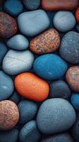 Colorful collection of smooth stones showcasing natural textures and shades in varied shapes photo