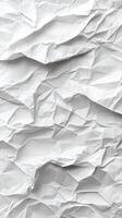 Crumpled white paper creates an abstract texture with shadows and folds in a bright lighting setting photo