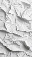 Crumpled white paper texture showcasing intricate folds and shadows in simple design elements photo