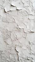 Textured wall surface showing peeling paint in a light gray tone captured in a well-lit indoor environment photo