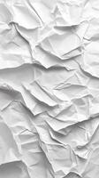 Crumpled white paper texture showcases intricate folds and creases in bright lighting photo