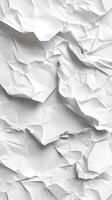 Crumpled white paper texture with varying folds and shadows in a bright setting photo