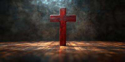 Wooden cross illuminated by dramatic lighting on a textured wooden surface in a dimly lit space photo