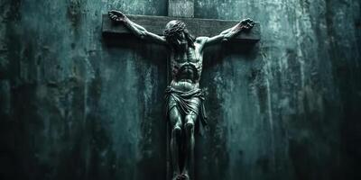 Sculpture of crucified figure on cross depicts moment of sacrifice in dark, somber setting photo