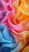 Colorful flowing fabric creates a vibrant abstract design with waves and folds showcasing pink, blue, orange, and red hues photo