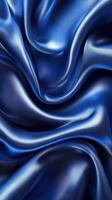 Elegantly draped royal blue satin fabric showcasing soft textures and smooth curves ideal for fashion or interior design photo