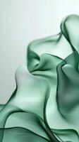 Soft green fabric flows gracefully in an elegant display capturing the essence of texture and color photo