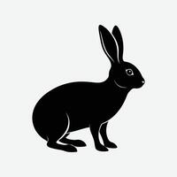 a black and white silhouette of a rabbit. vector