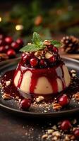 Delicious dessert with berry sauce and nuts served on a dark plate during a festive gathering photo