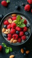 Colorful bowl of chia seed pudding topped with fresh berries and nuts in bright kitchen setting photo