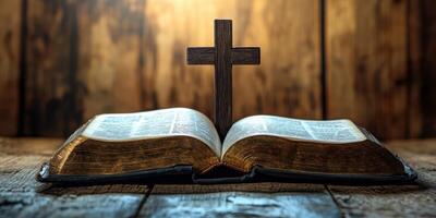 Open leather-bound Bible with wooden cross in a softly lit rustic setting photo