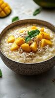 Creamy coconut rice bowl topped with fresh mango and shredded coconut in a cozy kitchen setting photo