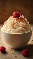 Creamy dessert topped with raspberries and toasted coconut on a rustic background photo