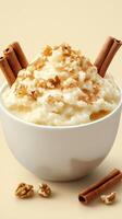 Delicious bowl of creamy rice pudding topped with walnuts and cinnamon sticks in a warm setting photo