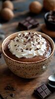 Decadent chocolate mousse topped with whipped cream and chocolate shavings in a rustic setting photo