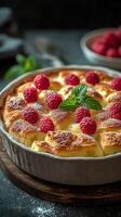Delicious raspberry dessert with mint garnish prepared in a rustic kitchen setting photo