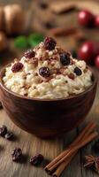 Creamy dessert topped with cocoa and dried fruits in a rustic wooden bowl on a wooden table during a cozy gathering photo