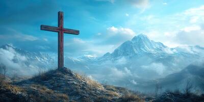 Scenic view of a wooden cross on rocky terrain with majestic mountains and clouds in the background during daylight photo