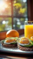 Breakfast spreads with avocado toast, sunny-side up eggs, fresh orange juice, and bright morning light in cozy kitchen setting photo