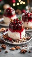 Festive dessert featuring layers of creamy panna cotta topped with red berry sauce and garnished with spices for a seasonal celebration photo