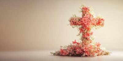 Cross made of pink flowers and greenery showcases beauty and elegance in a simple setting photo