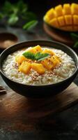 Creamy rice pudding topped with fresh mango and mint in a cozy kitchen setting photo