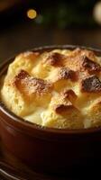 Warm and fluffy baked custard dessert served in a rustic dish during a cozy gathering photo