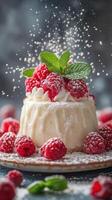Decadent raspberry dessert with creamy texture and mint garnish presented on a plate photo