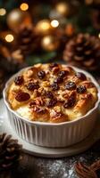 Warm bread pudding topped with nuts and raisins with holiday decorations in the background photo