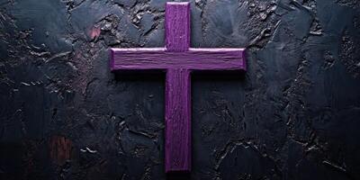 Vibrant purple wooden cross stands against a textured dark background creating a striking visual contrast for reflection photo