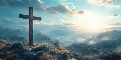 Cross stands tall on rocky hillside overlooking a breathtaking valley at dawn photo