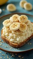 Delicious toast with banana slices and sprinkled seeds served on a blue plate at breakfast time photo