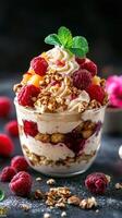 Delicious dessert with layers of cream, berries, and granola served in a clear glass cup at a cozy cafe photo