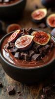 Decadent dark chocolate mousse topped with fresh figs on a rustic wooden table photo