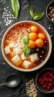 Delightful dessert bowl with sweet toppings and fresh herbs on a dark stone surface photo